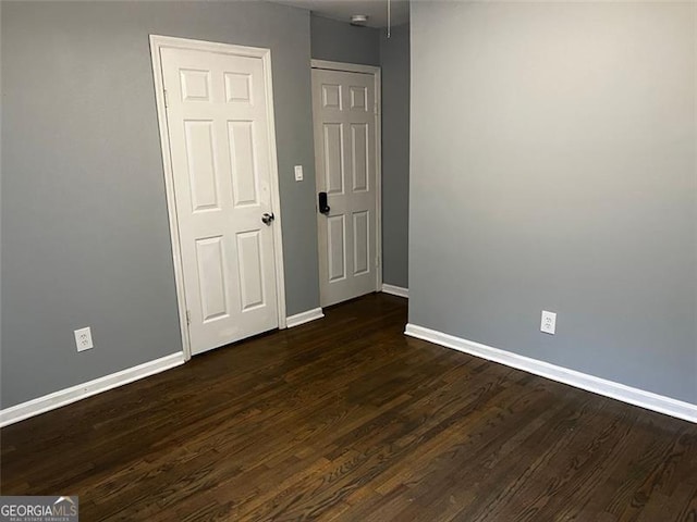 2436 Glenrock Dr, Decatur, GA 30032 - unfurnished room featuring baseboards and dark wood-style flooring
