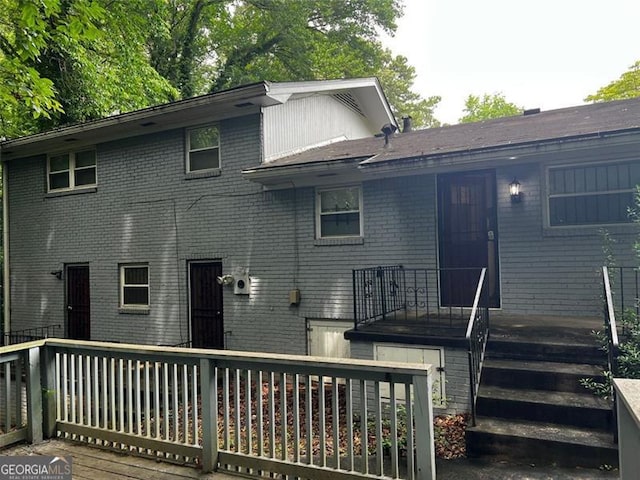 2436 Glenrock Dr, Decatur, GA 30032 - back of house featuring brick siding and a wooden deck