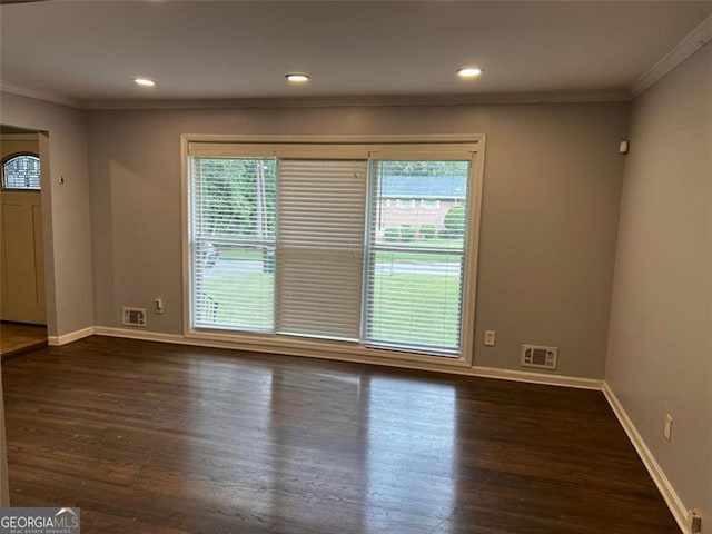 2436 Glenrock Dr, Decatur, GA 30032 - spare room featuring healthy amount of natural light, crown molding, dark wood-type flooring, and recessed lighting