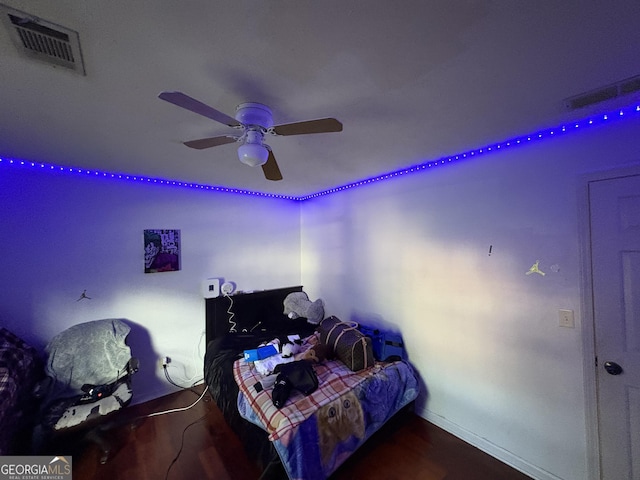 2119 Amherst Trl SE, Conyers, GA 30094 - bedroom with a ceiling fan and wood finished floors