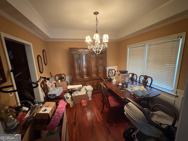 2119 Amherst Trl SE, Conyers, GA 30094 - dining area featuring wood finished floors, a chandelier, a tray ceiling, a desk, and crown molding