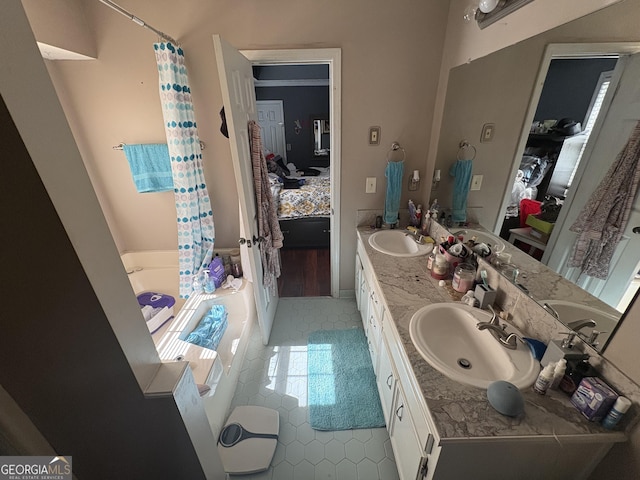 2119 Amherst Trl SE, Conyers, GA 30094 - ensuite bathroom featuring tile patterned flooring, double vanity, a bathtub, and a shower with shower curtain