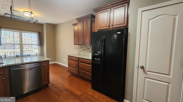 488 Morris Rd, Hiram, GA 30141 - kitchen with black refrigerator with ice dispenser, dishwasher, dark wood finished floors, decorative backsplash, and light stone counters