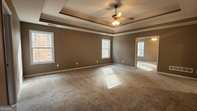 488 Morris Rd, Hiram, GA 30141 - carpeted spare room with a tray ceiling, crown molding, and a ceiling fan