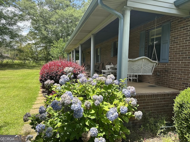 260 Willis Rd, Sharpsburg, GA 30277 - view of side of property with brick siding and a lawn