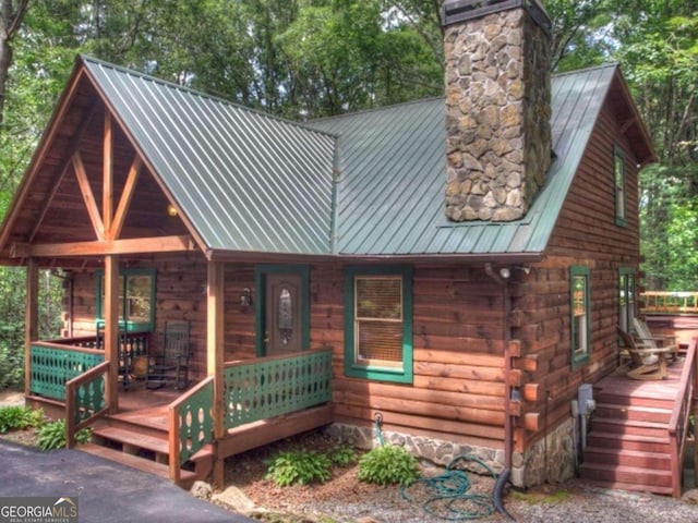 97 Eagles Nest Rd, Sautee Nacoochee, GA 30571 - log home featuring a porch, a chimney, a metal roof, and log siding
