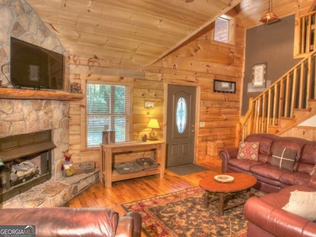 97 Eagles Nest Rd, Sautee Nacoochee, GA 30571 - living area with lofted ceiling, wood ceiling, wood finished floors, stairway, and wood walls