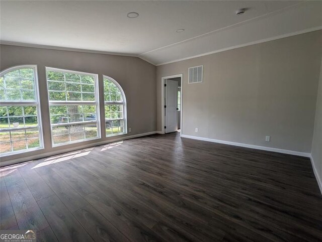 732 Five Points Rd, Buchanan, GA 30113 - empty room with lofted ceiling, dark wood-style floors, and ornamental molding