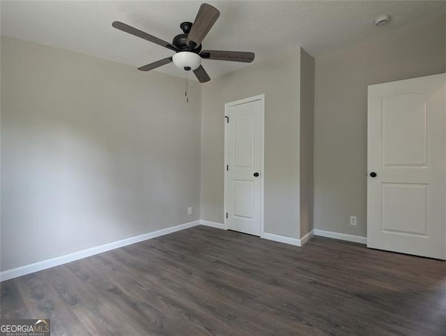 732 Five Points Rd, Buchanan, GA 30113 - unfurnished bedroom featuring dark wood finished floors and a ceiling fan