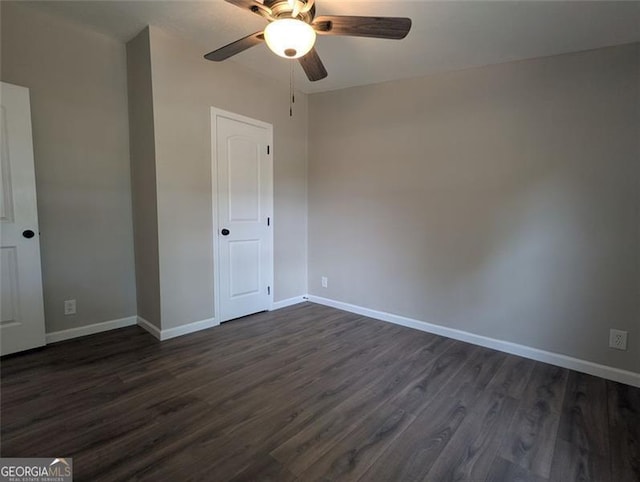 732 Five Points Rd, Buchanan, GA 30113 - unfurnished bedroom featuring dark wood-style floors and a ceiling fan