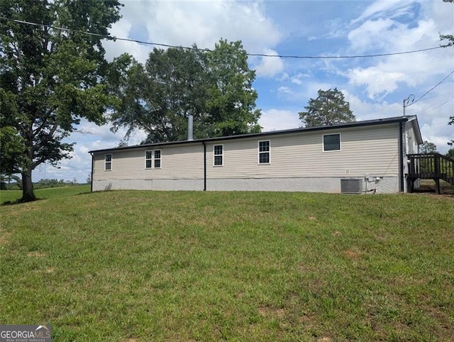 732 Five Points Rd, Buchanan, GA 30113 - back of house featuring a lawn