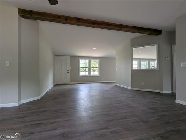 732 Five Points Rd, Buchanan, GA 30113 - unfurnished living room featuring beamed ceiling and dark wood-style flooring