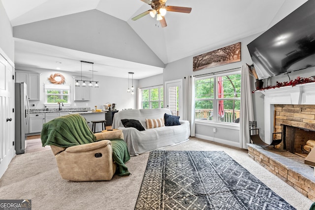 481 Hunter Welch Pkwy, Luthersville, GA 30251 - living area with a ceiling fan, a stone fireplace, high vaulted ceiling, light carpet, and recessed lighting