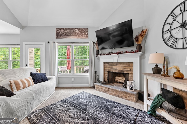 481 Hunter Welch Pkwy, Luthersville, GA 30251 - carpeted living room featuring vaulted ceiling and a fireplace with raised hearth