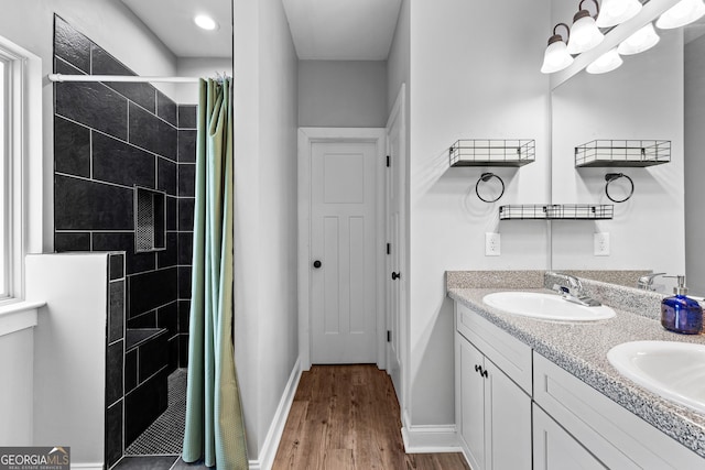 481 Hunter Welch Pkwy, Luthersville, GA 30251 - bathroom with tiled shower, wood finished floors, and double vanity