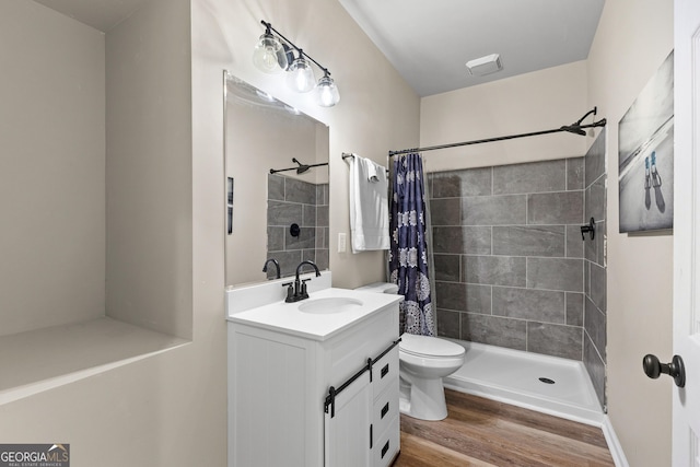 481 Hunter Welch Pkwy, Luthersville, GA 30251 - bathroom featuring vanity, tiled shower, and wood finished floors