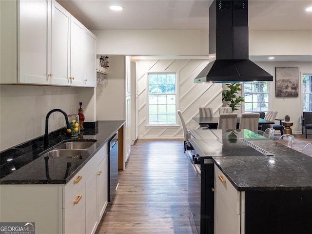3790 Village, Atlanta, GA 30331 - kitchen featuring island exhaust hood, electric range oven, wood finished floors, white cabinets, and dishwasher