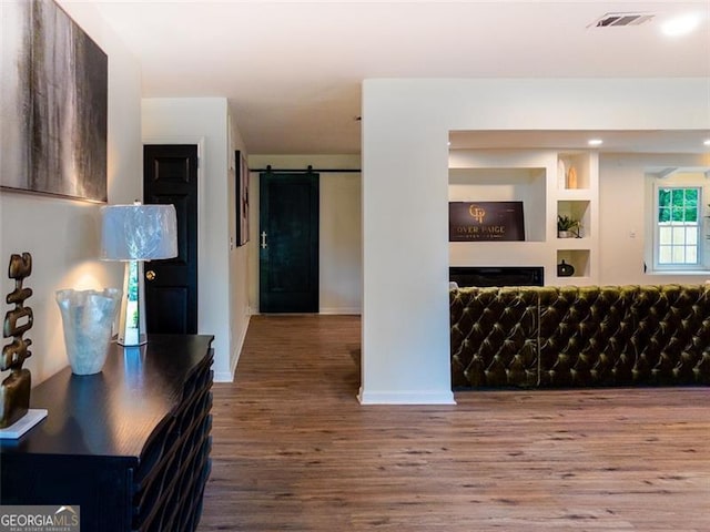 3790 Village, Atlanta, GA 30331 - living room featuring wood finished floors, a barn door, and a fireplace