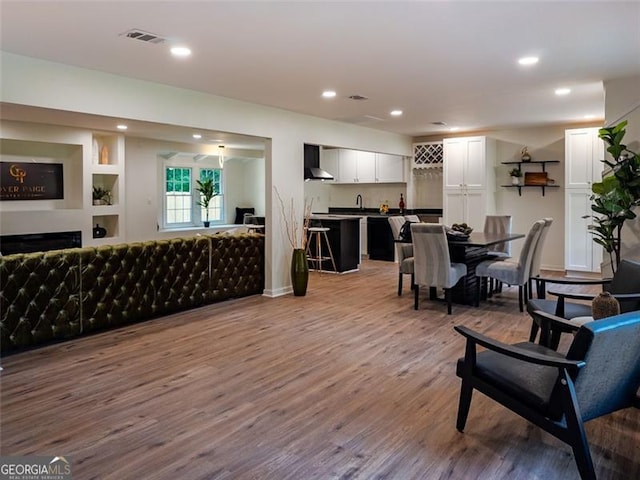 3790 Village, Atlanta, GA 30331 - living area with bar with sink, wood finished floors, recessed lighting, and a fireplace