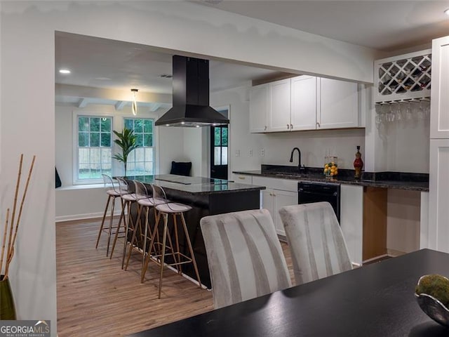 3790 Village, Atlanta, GA 30331 - kitchen featuring island exhaust hood, dishwasher, light wood-style flooring, a breakfast bar, and white cabinets