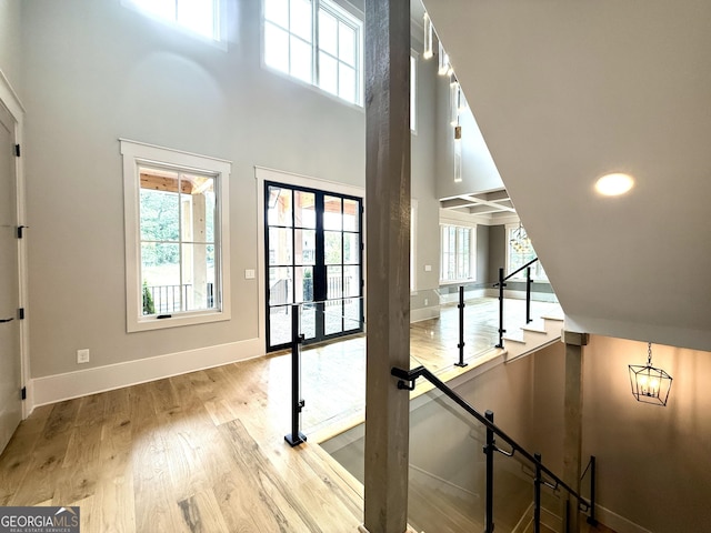 1005 Haddie Way, Alpharetta, GA 30004 - doorway to outside featuring wood finished floors, a towering ceiling, stairway, and recessed lighting