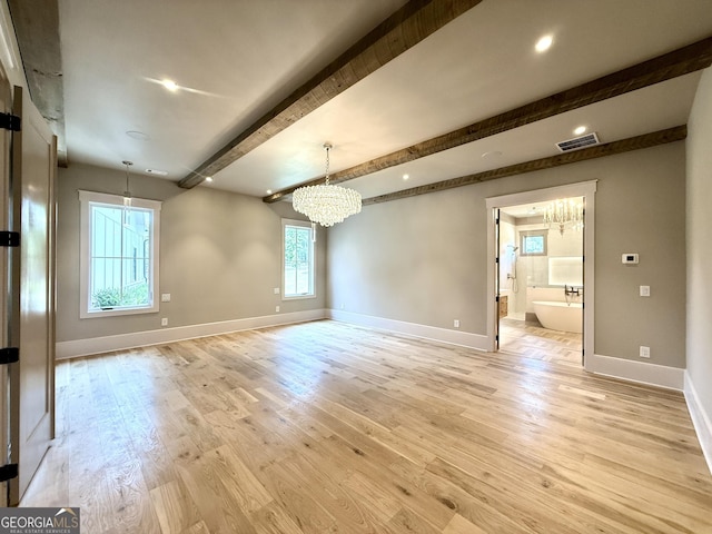 1005 Haddie Way, Alpharetta, GA 30004 - unfurnished room featuring a chandelier, beam ceiling, and light wood-style flooring
