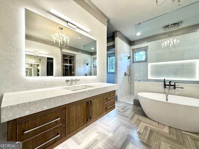 1005 Haddie Way, Alpharetta, GA 30004 - bathroom featuring a chandelier, walk in shower, a freestanding tub, and vanity