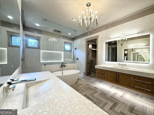 1005 Haddie Way, Alpharetta, GA 30004 - bathroom featuring a chandelier, walk in shower, vanity, and a freestanding tub