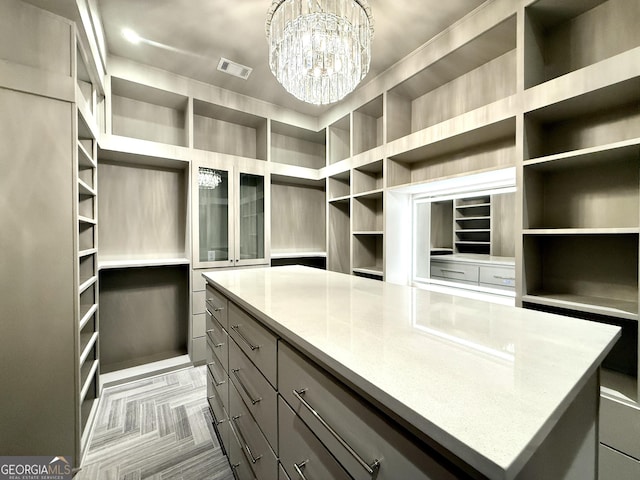 1005 Haddie Way, Alpharetta, GA 30004 - walk in closet featuring a chandelier
