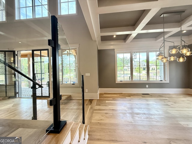 1005 Haddie Way, Alpharetta, GA 30004 - foyer featuring coffered ceiling, wood finished floors, beamed ceiling, and a chandelier