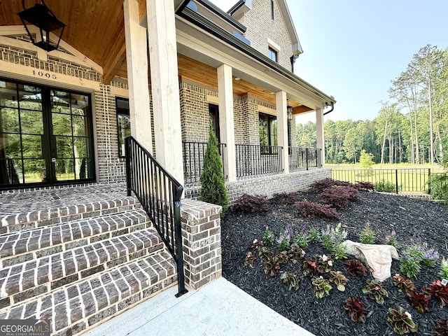 1005 Haddie Way, Alpharetta, GA 30004 - view of exterior entry featuring covered porch and brick siding