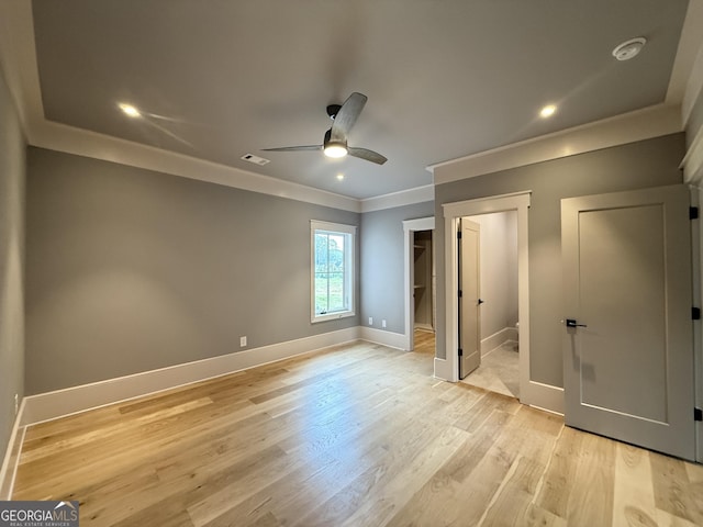 1005 Haddie Way, Alpharetta, GA 30004 - unfurnished bedroom with ornamental molding, light wood-style floors, a spacious closet, a ceiling fan, and recessed lighting