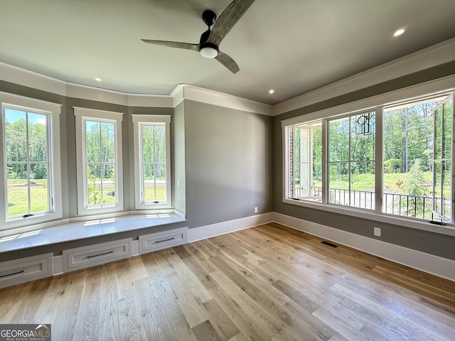 1005 Haddie Way, Alpharetta, GA 30004 - spare room featuring plenty of natural light, a ceiling fan, light wood-style floors, crown molding, and recessed lighting
