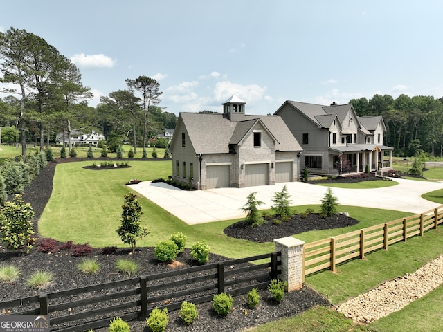 1005 Haddie Way, Alpharetta, GA 30004 - view of home's exterior with a fenced front yard, driveway, board and batten siding, a porch, and a shingled roof