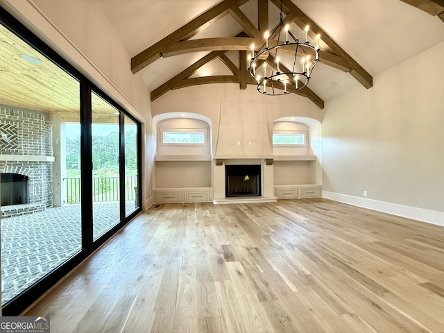 1005 Haddie Way, Alpharetta, GA 30004 - unfurnished living room with a fireplace, a chandelier, high vaulted ceiling, beam ceiling, and wood finished floors