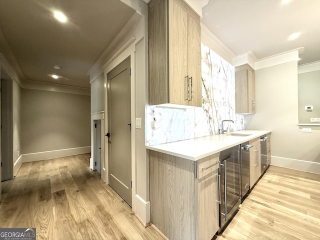 1005 Haddie Way, Alpharetta, GA 30004 - kitchen featuring wine cooler, ornamental molding, light countertops, light wood-style flooring, and light brown cabinetry
