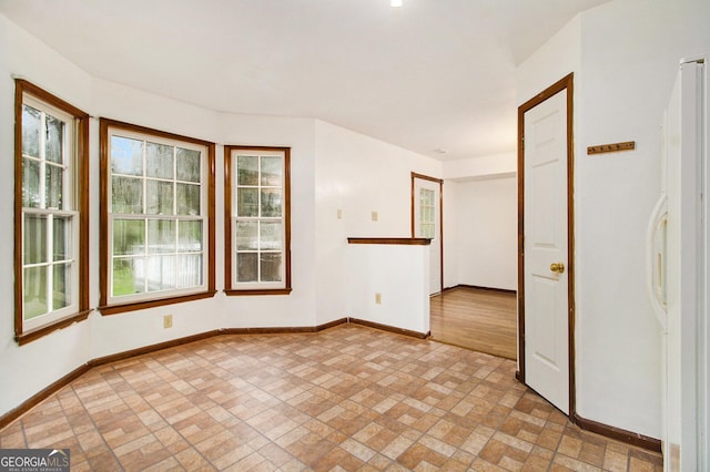 4214 Fiddlers Bnd, Loganville, GA 30052 - spare room featuring brick patterned floors and baseboards