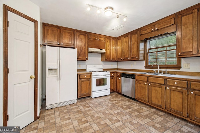 4214 Fiddlers Bnd, Loganville, GA 30052 - kitchen featuring white appliances, under cabinet range hood, brick patterned flooring, and brown cabinetry