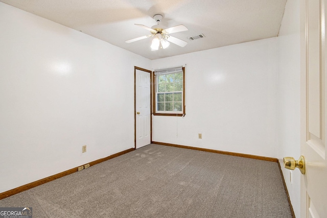 4214 Fiddlers Bnd, Loganville, GA 30052 - spare room with carpet flooring and a ceiling fan