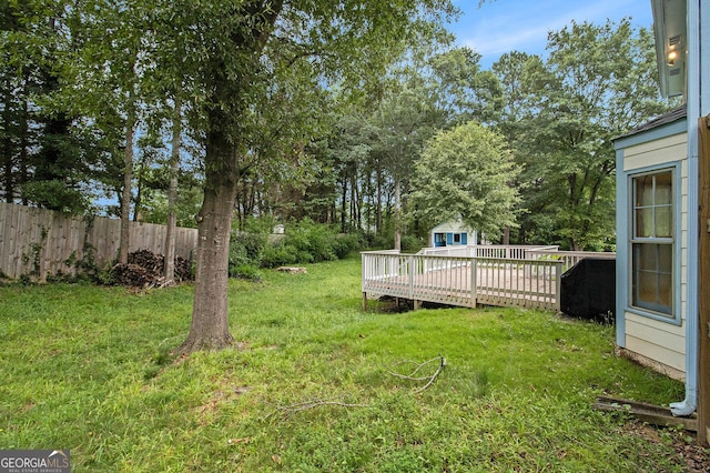 4214 Fiddlers Bnd, Loganville, GA 30052 - view of yard with a wooden deck