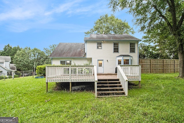 4214 Fiddlers Bnd, Loganville, GA 30052 - back of house with a wooden deck