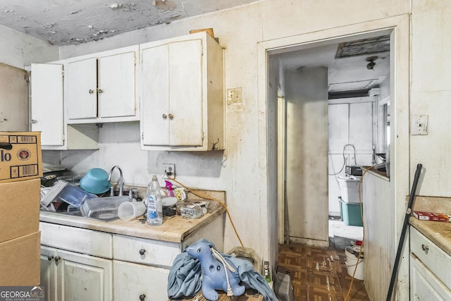 1333 Joseph Ave, Warner Robins, GA 31088 - kitchen featuring light countertops and white cabinetry