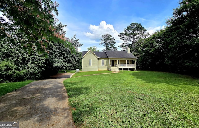 165 Cedar Ridge Rd, Locust Grove, GA 30248 - view of front of property with a front yard and a chimney