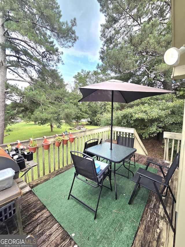 165 Cedar Ridge Rd, Locust Grove, GA 30248 - wooden deck featuring outdoor dining space and a yard