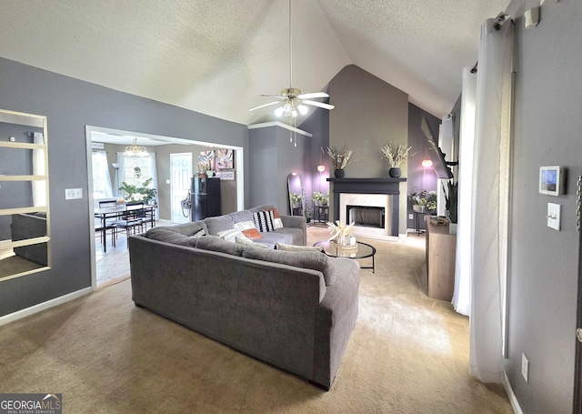 165 Cedar Ridge Rd, Locust Grove, GA 30248 - living area featuring carpet floors, vaulted ceiling, a high end fireplace, a textured ceiling, and ceiling fan