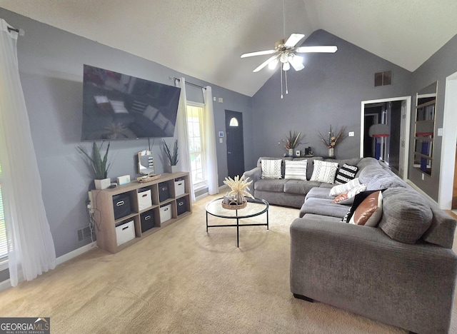 165 Cedar Ridge Rd, Locust Grove, GA 30248 - living area featuring a ceiling fan, light colored carpet, and high vaulted ceiling