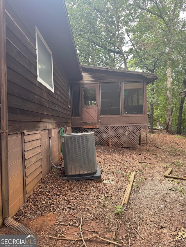 3411 Lake Ridge Pl, Gainesville, GA 30506 - view of property exterior with a cooling unit and a sunroom