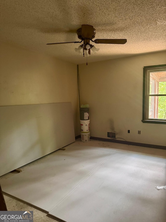 3411 Lake Ridge Pl, Gainesville, GA 30506 - empty room featuring concrete floors, ceiling fan, and a textured ceiling