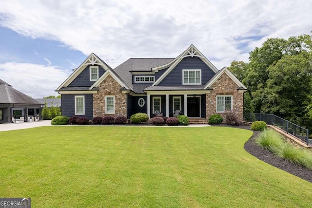481 Meadow Lake Ter, Hoschton, GA 30548 - craftsman-style home with a porch and stone siding