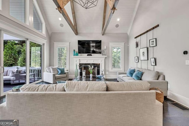 481 Meadow Lake Ter, Hoschton, GA 30548 - living area featuring plenty of natural light, beamed ceiling, high vaulted ceiling, a fireplace, and dark wood finished floors